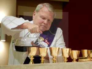 Deacon Pouring Wine - Simple Catholic